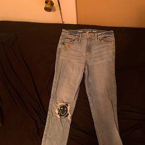 A cute pair of jeans with peace signs, a rainbow in a :-)